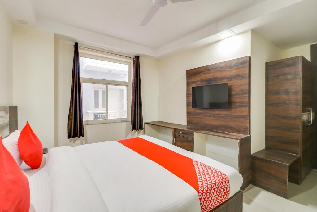 Postel nebo postele na pokoji v ubytování Hotel O Aero Inn