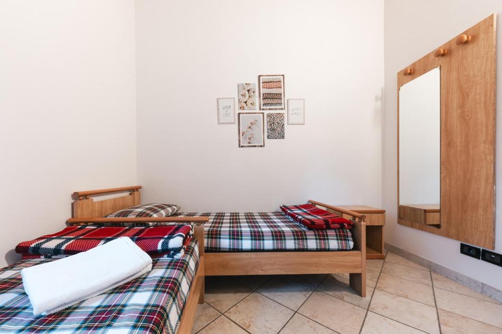 Postel nebo postele na pokoji v ubytování Forest Camp Val di Gresta