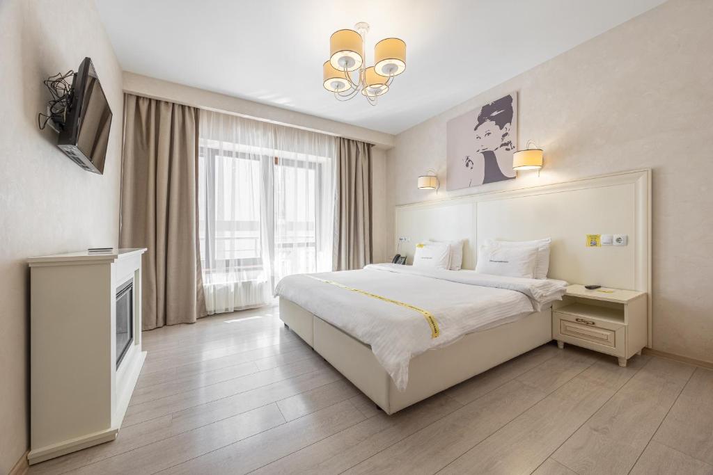 Postel nebo postele na pokoji v ubytování Helios Hotel & SPA