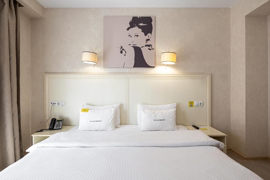 Postel nebo postele na pokoji v ubytování Helios Hotel & SPA