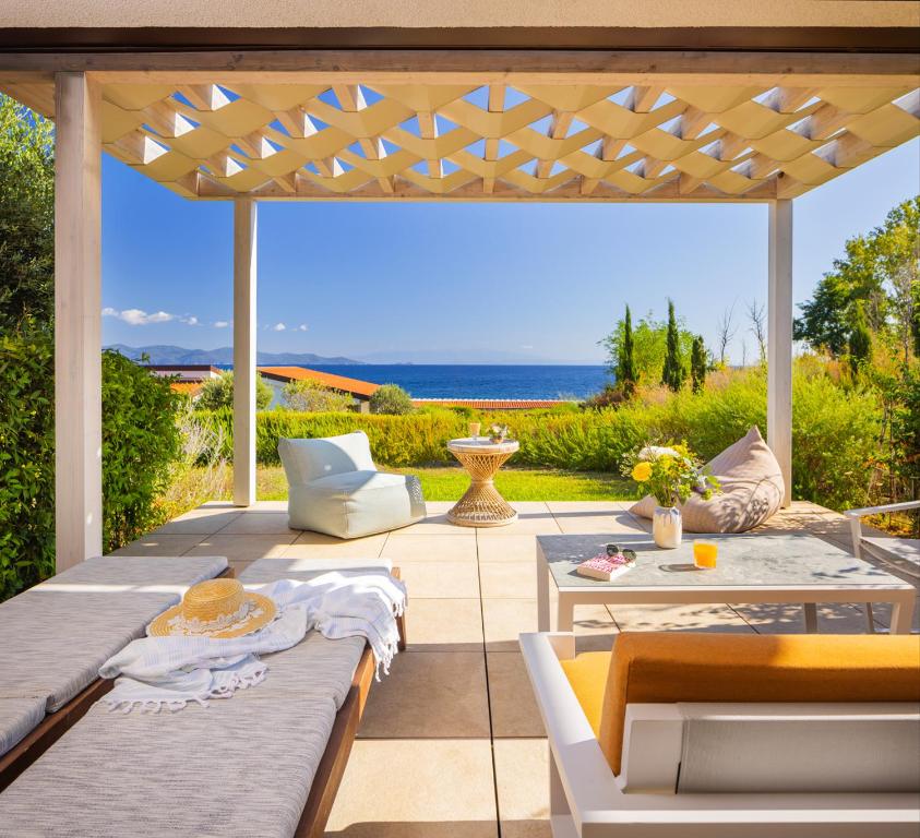 a patio with a view of the ocean at Mount Athos Resort in Ierissos