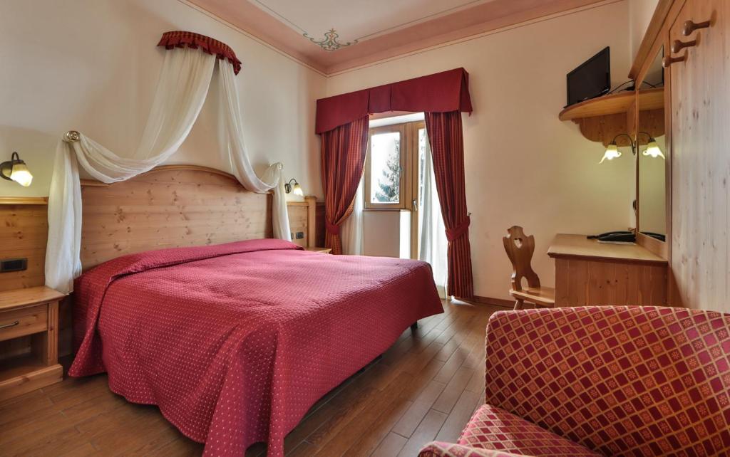 Łóżko lub łóżka w pokoju w obiekcie Hotel Fai