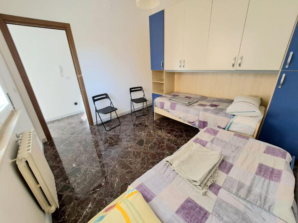 Posteľ alebo postele v izbe v ubytovaní Casa Cala Portecchia
