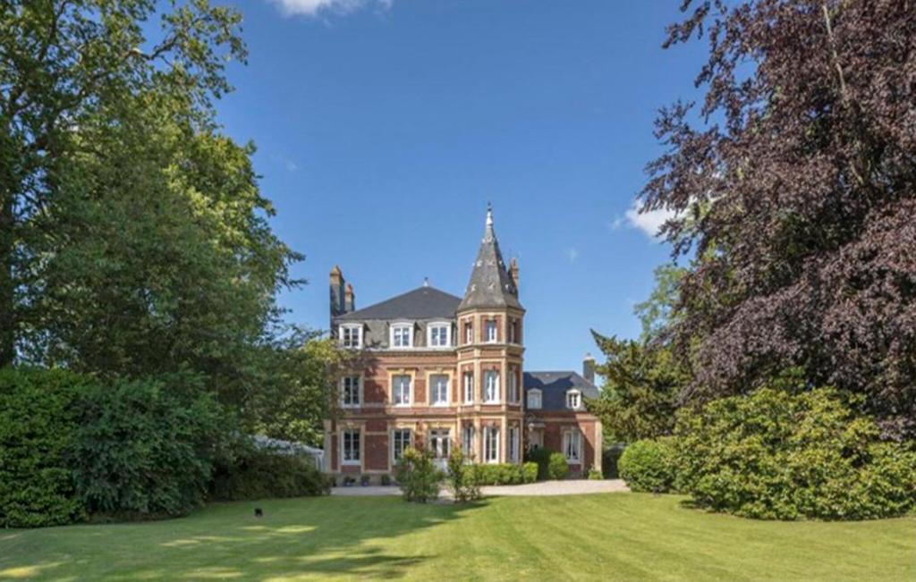 a large house in a field with trees at Stunning Home In Luneray With Wifi in Luneray