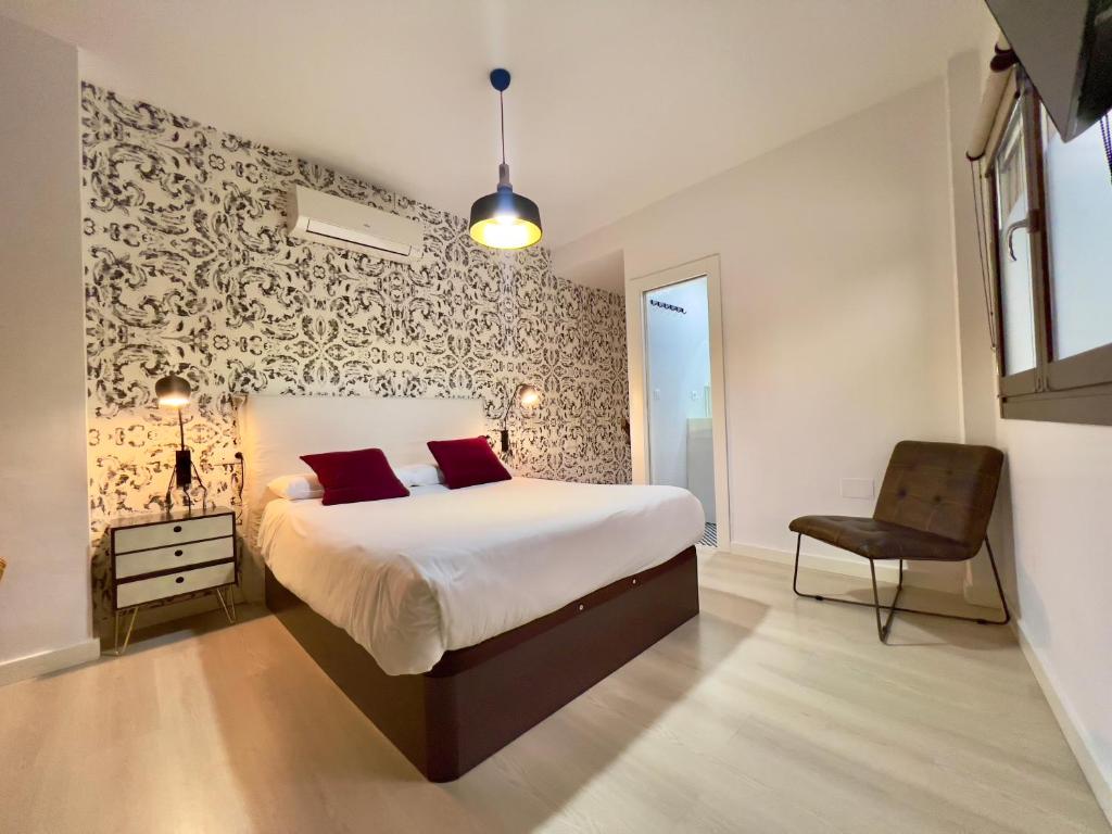 Posteľ alebo postele v izbe v ubytovaní Apartamentos Real Suites Realejo