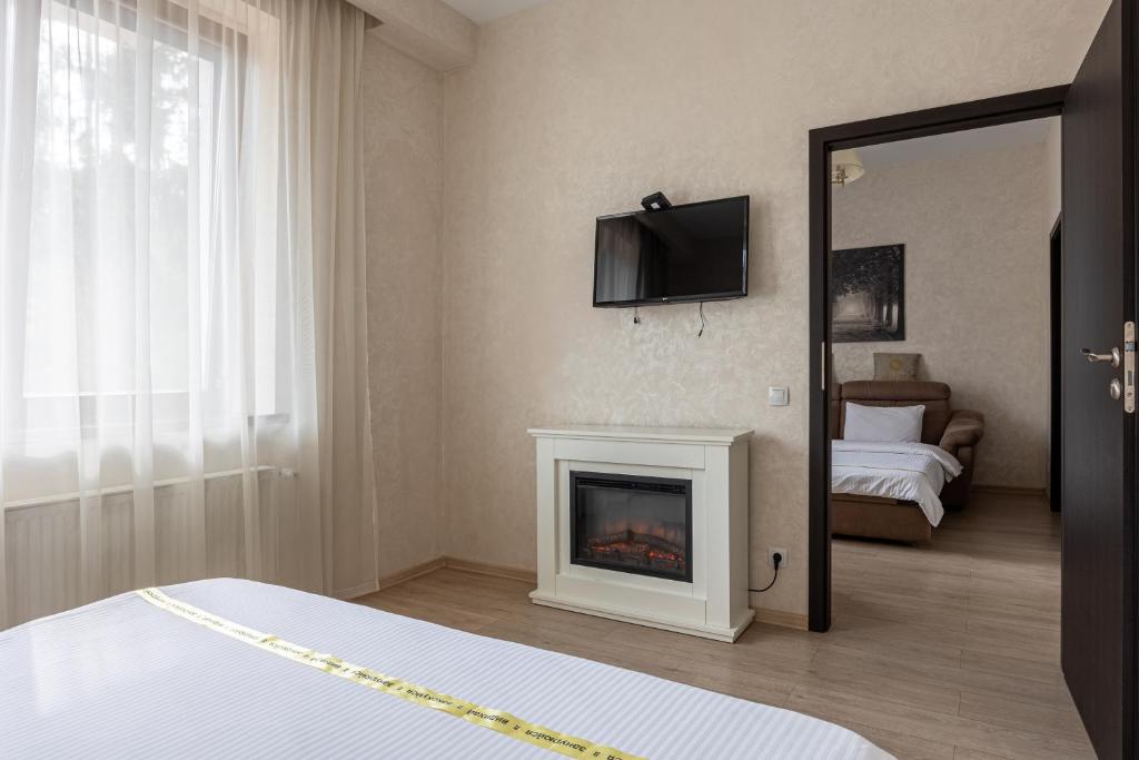 Postel nebo postele na pokoji v ubytování Helios Hotel & SPA