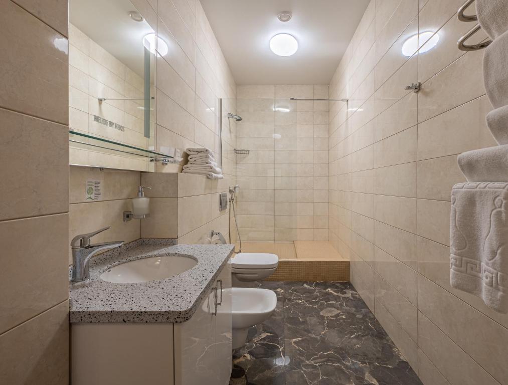 Koupelna v ubytování Helios Hotel & SPA