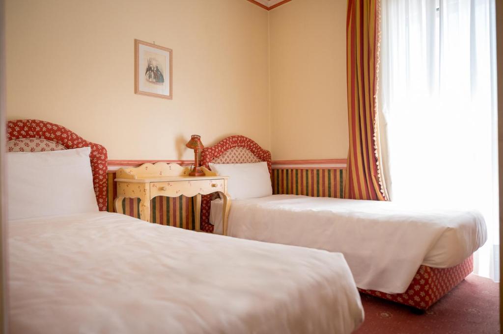 Postel nebo postele na pokoji v ubytování DB Villas Le Ville del Lido Resort