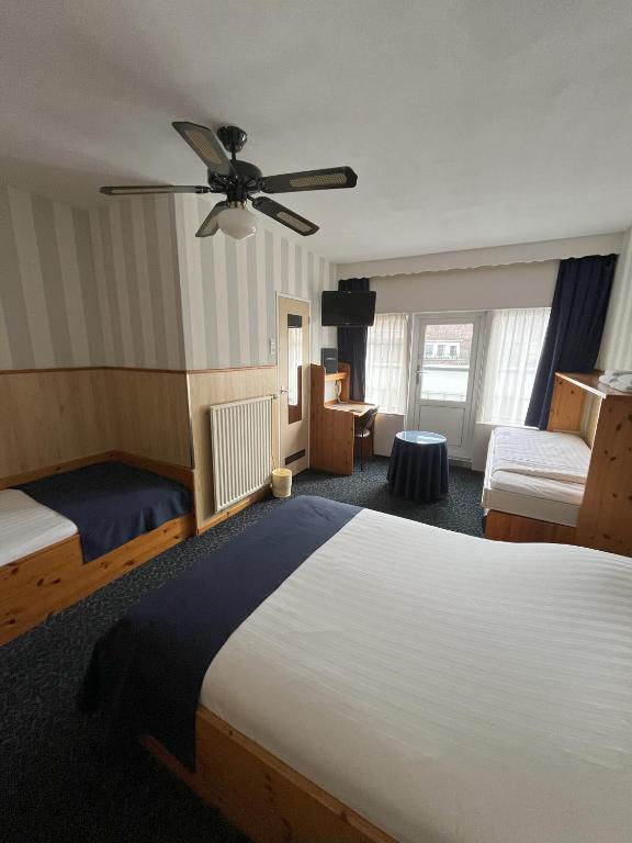 Postel nebo postele na pokoji v ubytování Hotel Breitner