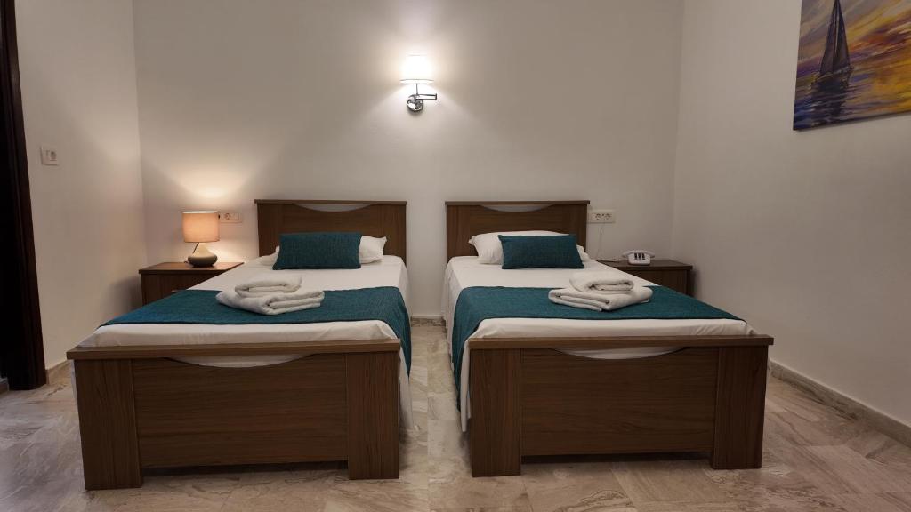 Postel nebo postele na pokoji v ubytování Hotel Marybill