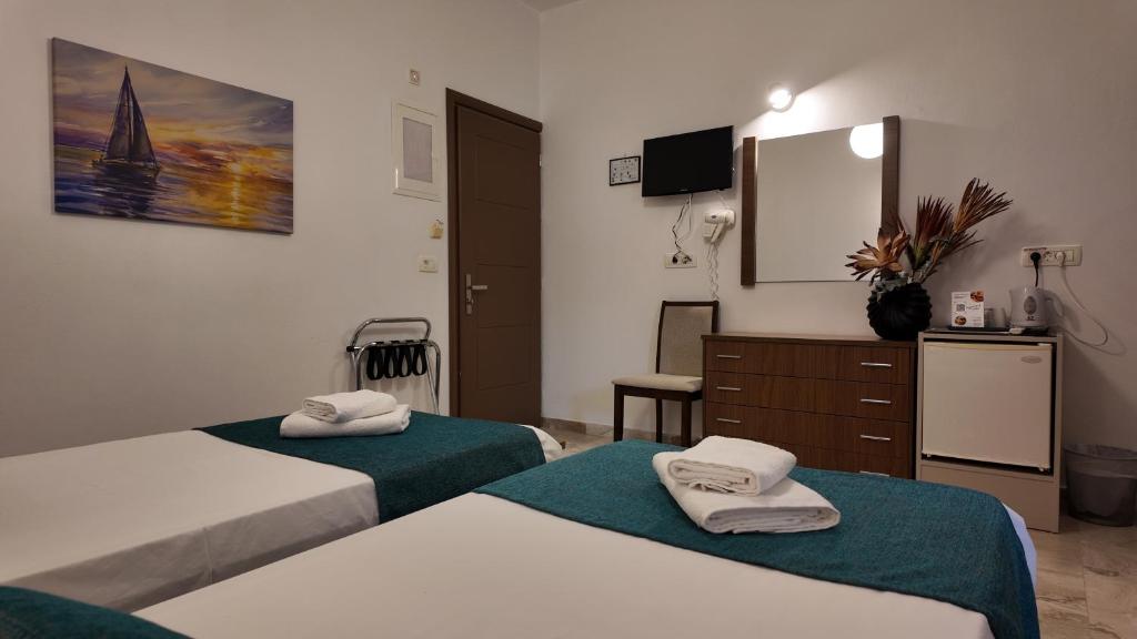 Postel nebo postele na pokoji v ubytování Hotel Marybill