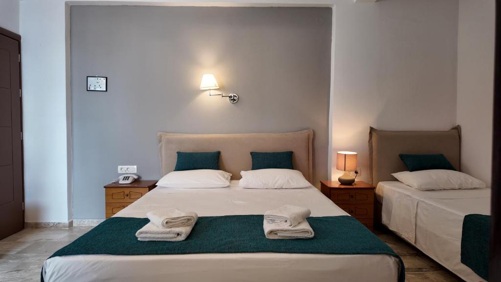 Postel nebo postele na pokoji v ubytování Hotel Marybill