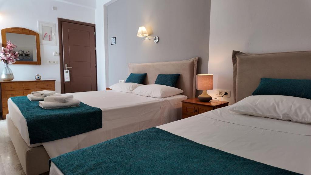 Postel nebo postele na pokoji v ubytování Hotel Marybill