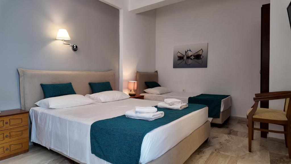 Postel nebo postele na pokoji v ubytování Hotel Marybill