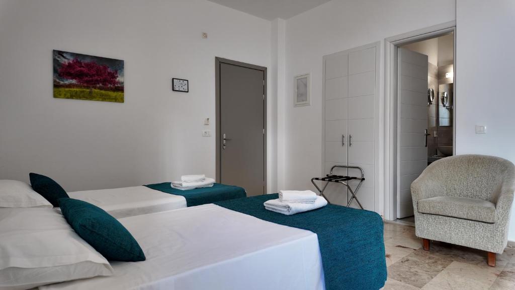 Postel nebo postele na pokoji v ubytování Hotel Marybill