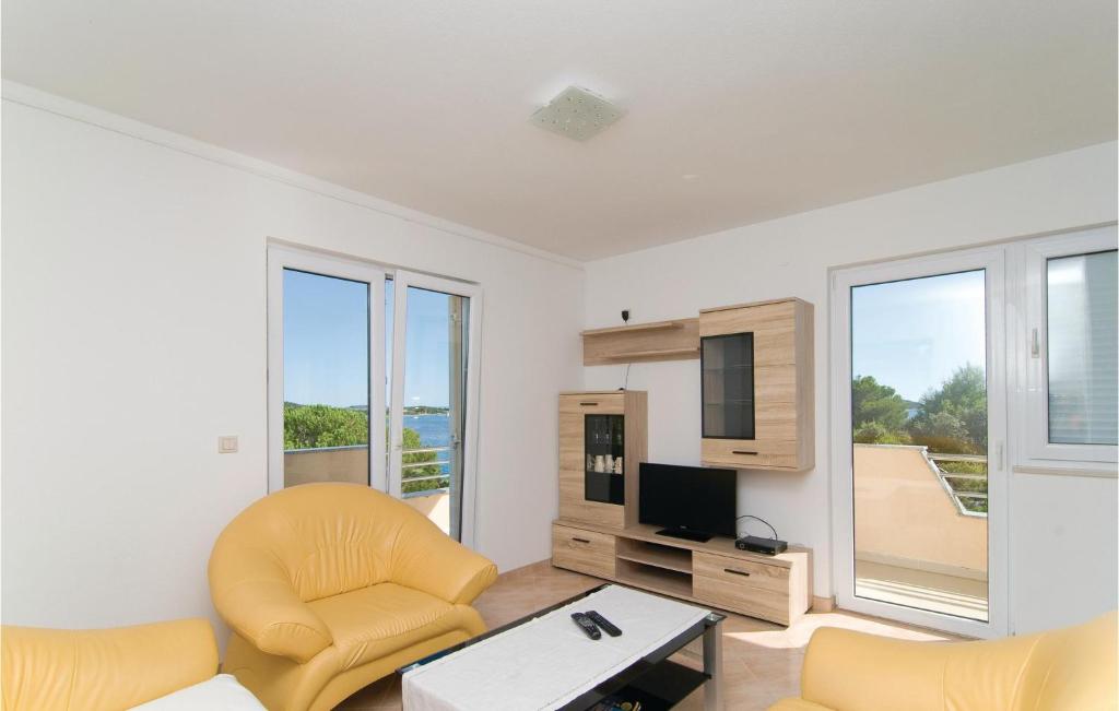 Televízia a/alebo spoločenská miestnosť v ubytovaní Apartment Sevid 53