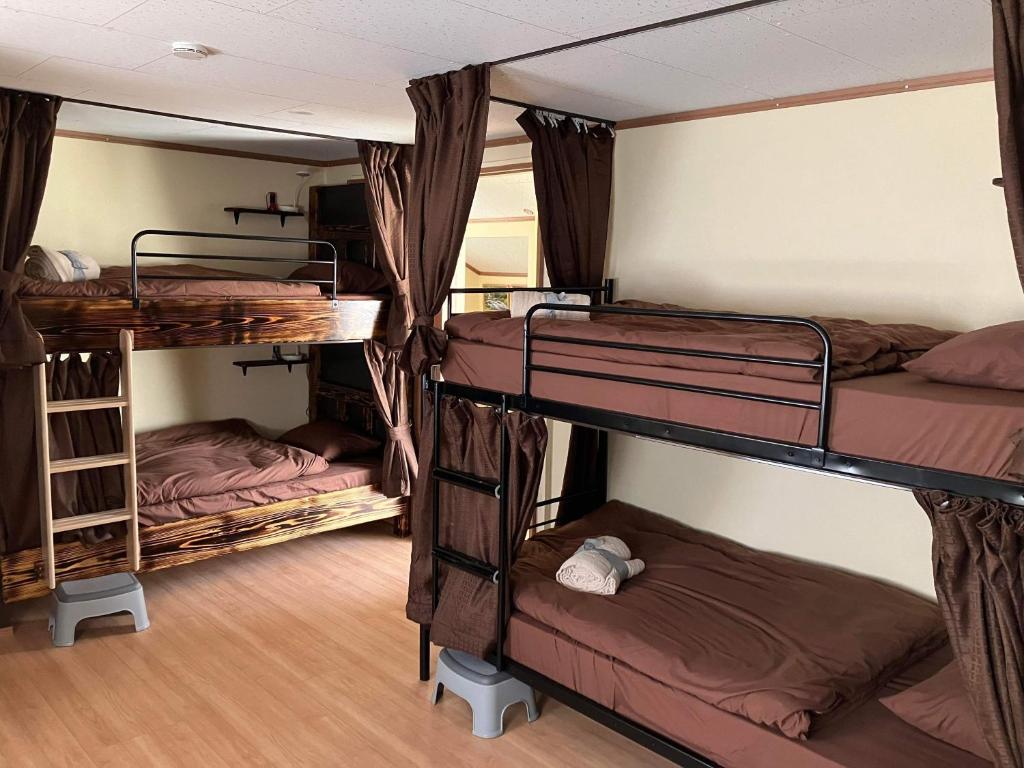 Postel nebo postele na pokoji v ubytování Guest house mochilero onomichi