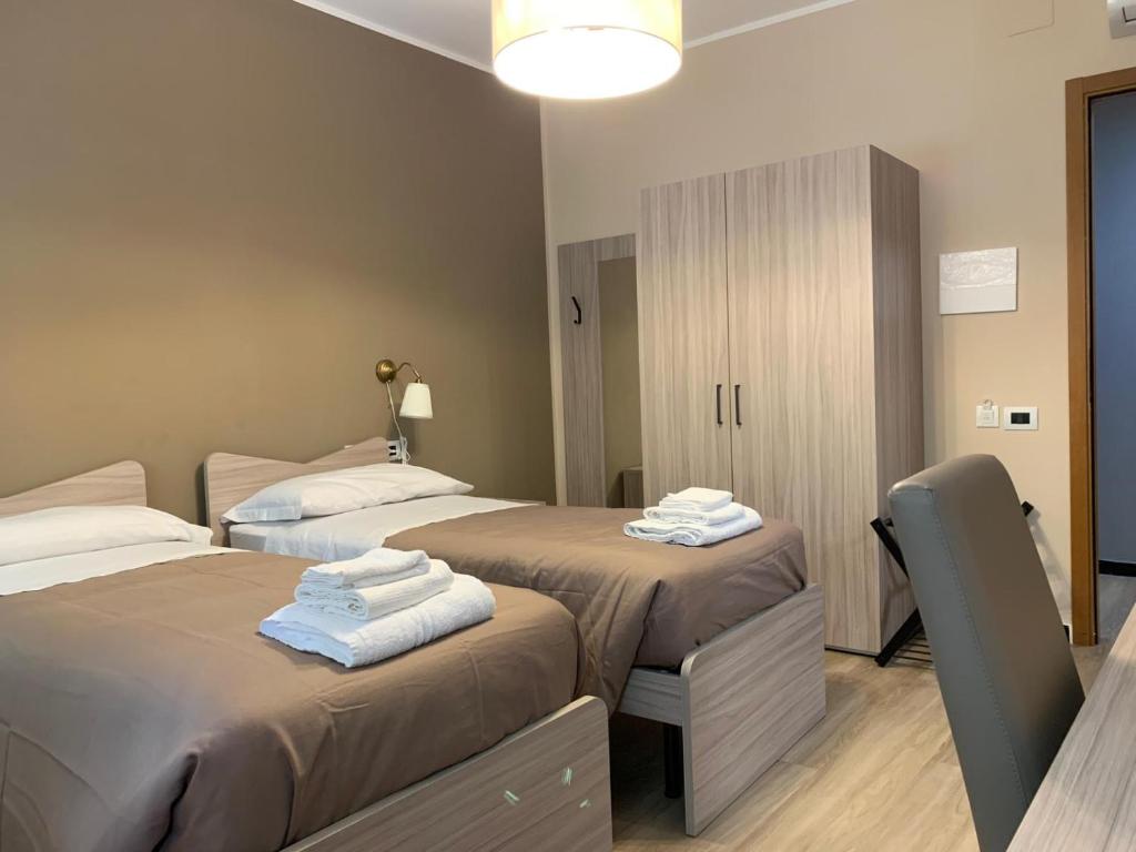 Postel nebo postele na pokoji v ubytování ALBERGO LOCANDA DIANA