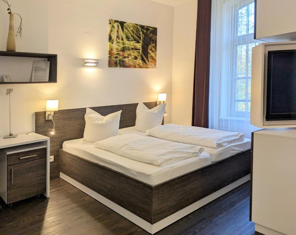 Postel nebo postele na pokoji v ubytování Boardinghaus Weinberg Campus