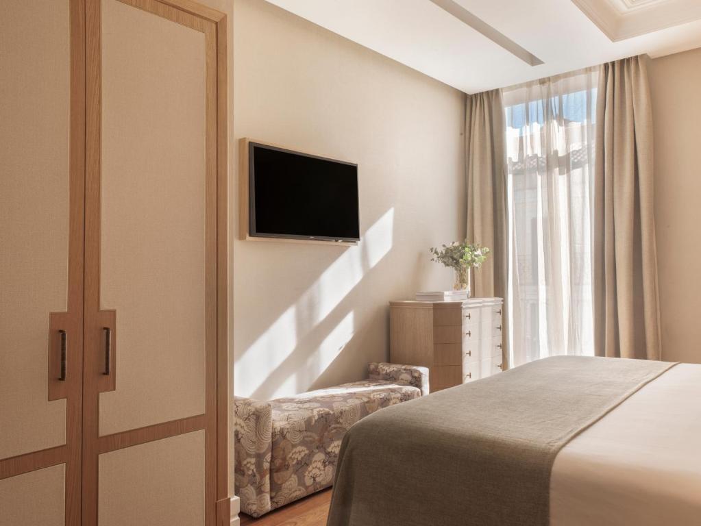TV a/nebo společenská místnost v ubytování Hotel Único Madrid, Small Luxury Hotels