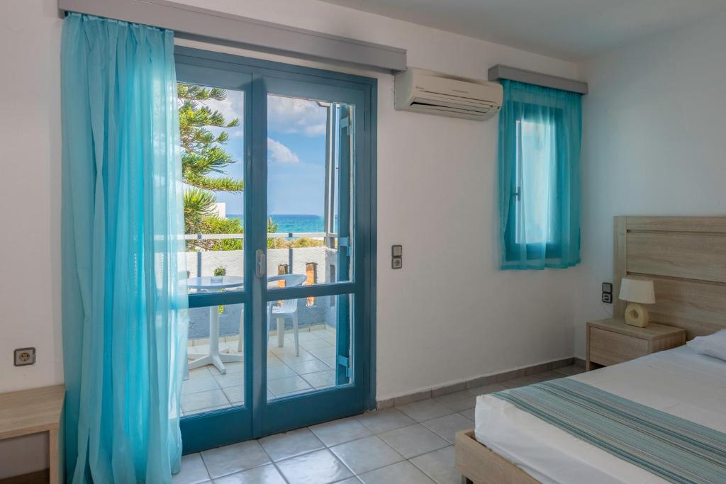 Postel nebo postele na pokoji v ubytování Marilisa Hotel