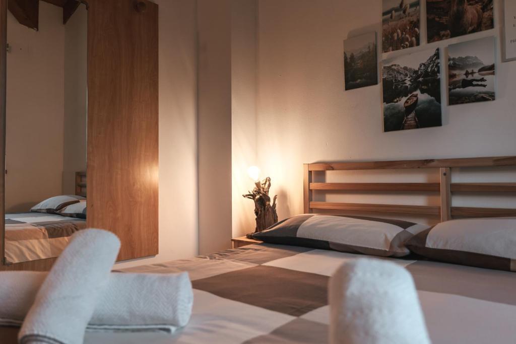 Postel nebo postele na pokoji v ubytování Forest Camp Val di Gresta