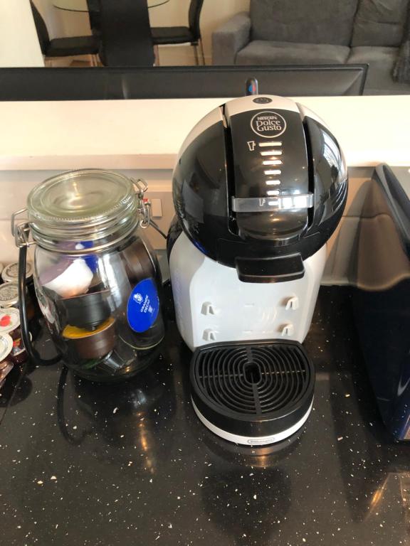 a coffee maker sitting on top of a counter at 20 minute to central London beautiful apartment in London