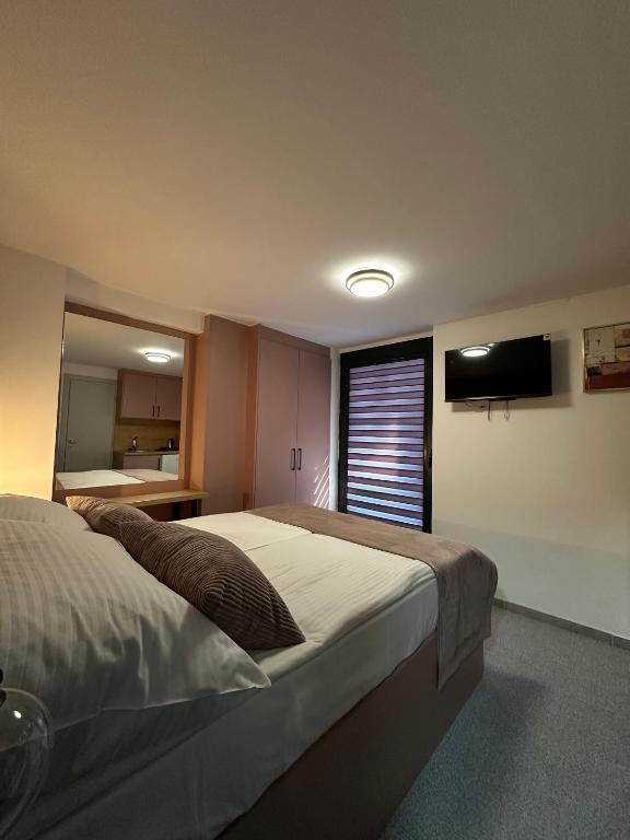 Postel nebo postele na pokoji v ubytování Alinar Oasis Apartments