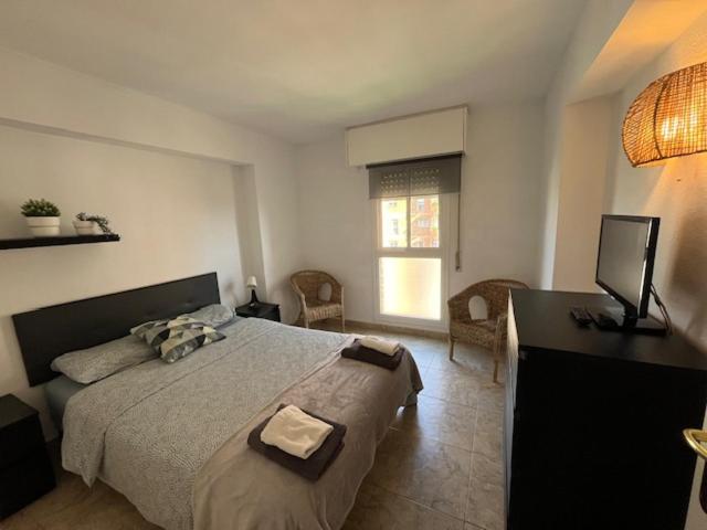 Łóżko lub łóżka w pokoju w obiekcie Apartamento Familiar