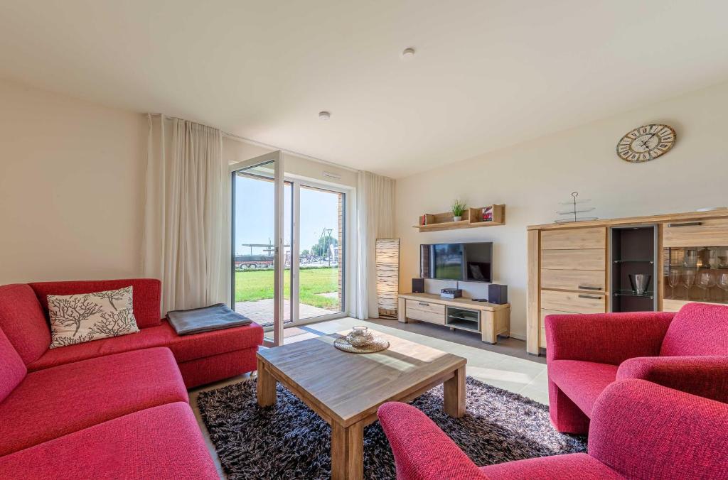 Μια τηλεόραση ή/και κέντρο ψυχαγωγίας στο Libelle - Apartment in der Hafenresidenz mit Kamin & Hafenblick