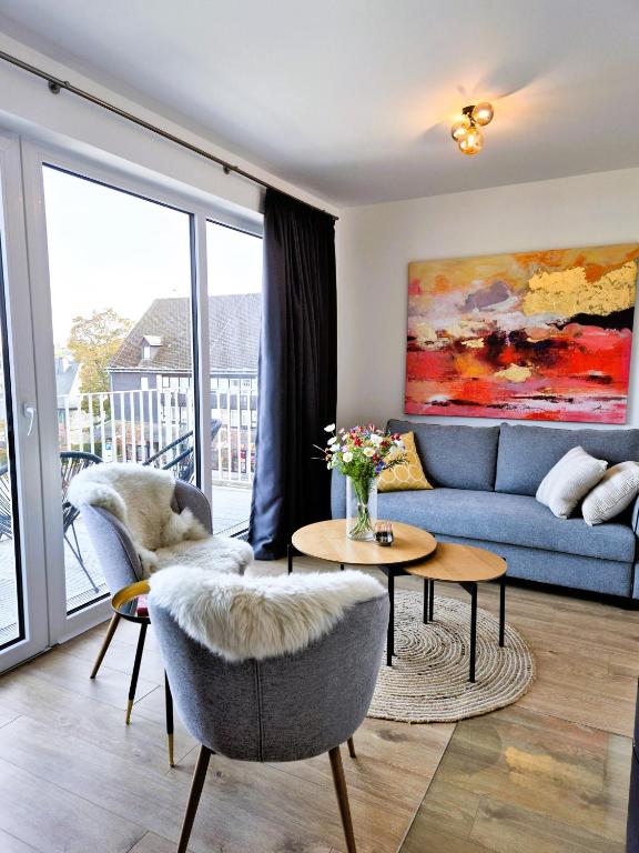 a living room with a couch and a table at Winterberg Appartement 21132 in Winterberg
