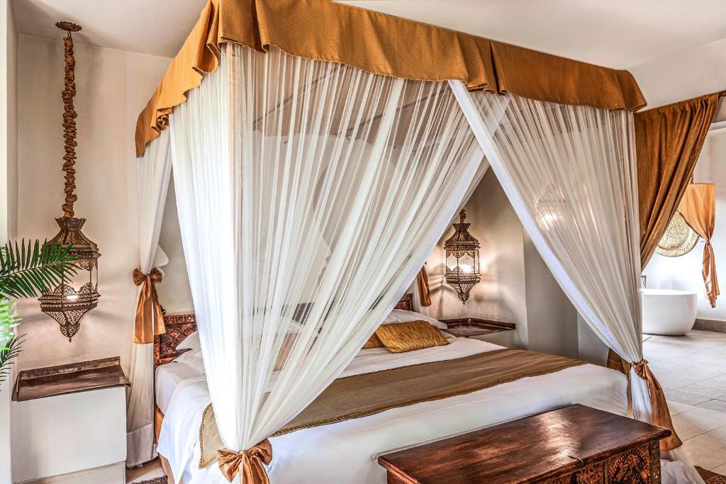 Cama o camas de una habitación en Baraza Resort and Spa Zanzibar