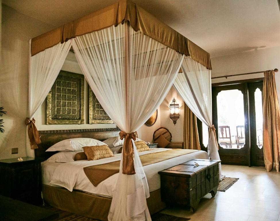 Cama o camas de una habitación en Baraza Resort and Spa Zanzibar