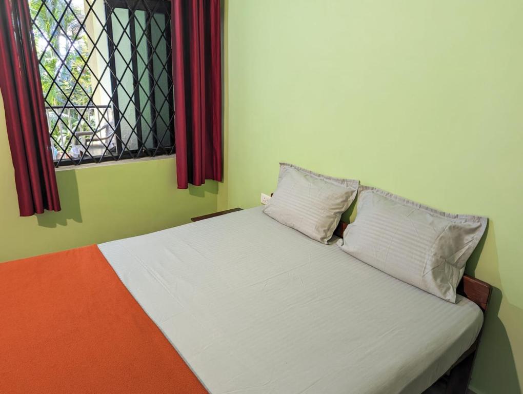 Postel nebo postele na pokoji v ubytování Luciano Guest House