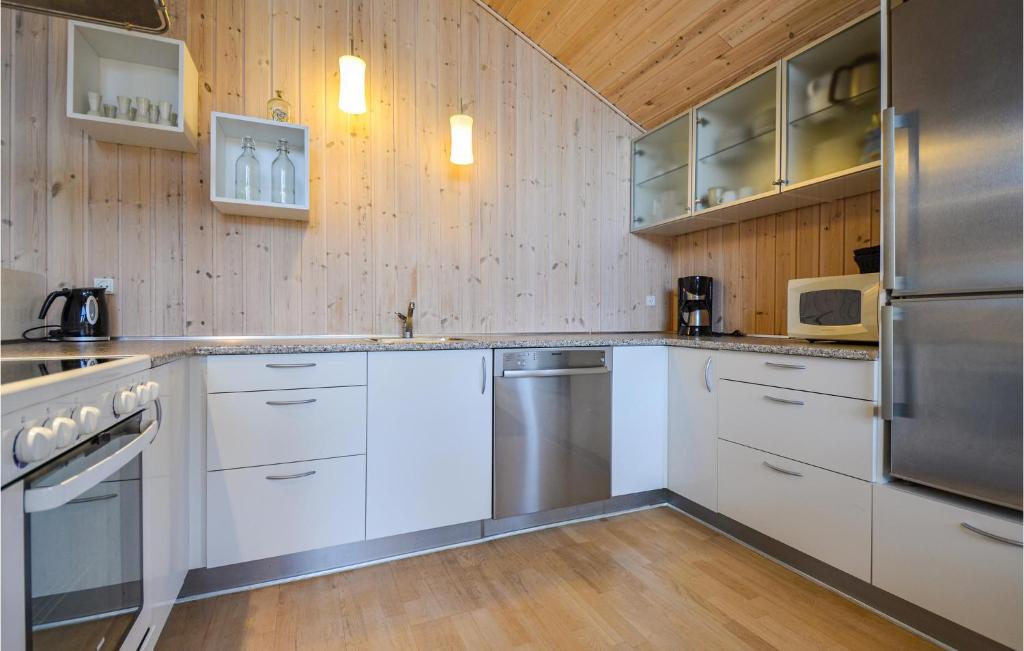 Kuchyň nebo kuchyňský kout v ubytování Holiday Home Capellavej