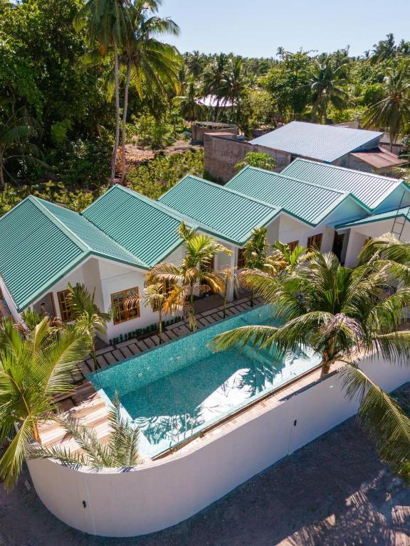 an aerial view of a house with a swimming pool at Kondey Villas in Kondey
