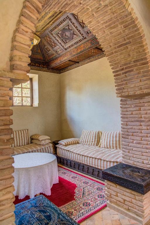 Postel nebo postele na pokoji v ubytování Riad Jnane Ines