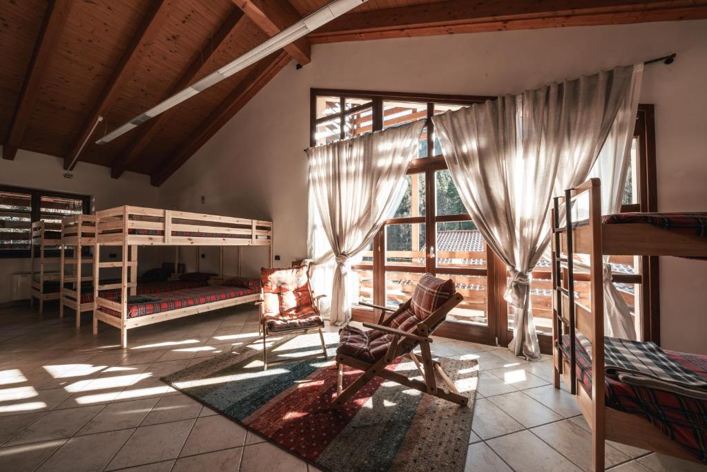 Postel nebo postele na pokoji v ubytování Forest Camp Val di Gresta