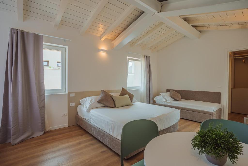 Postel nebo postele na pokoji v ubytování Garda Relais