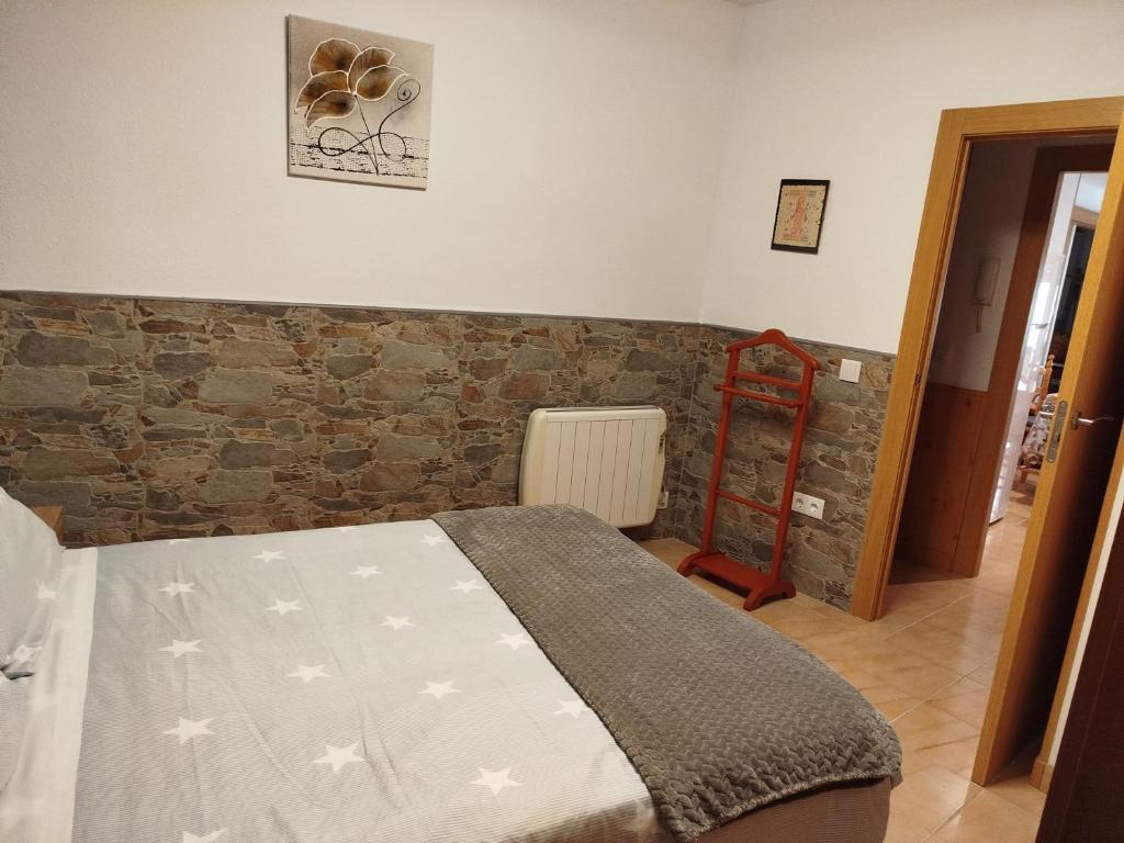 A bed or beds in a room at Apartamento Plano Royo 2º