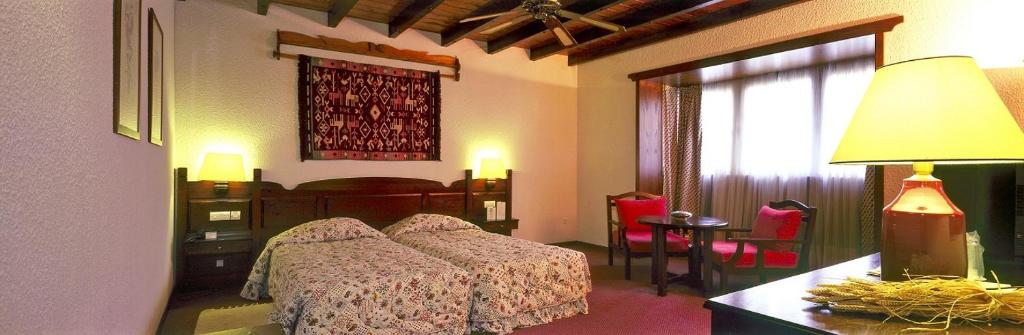 Postel nebo postele na pokoji v ubytování HOTEL SPA MONTANA