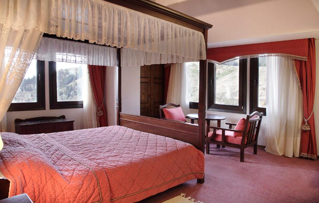 Postel nebo postele na pokoji v ubytování HOTEL SPA MONTANA