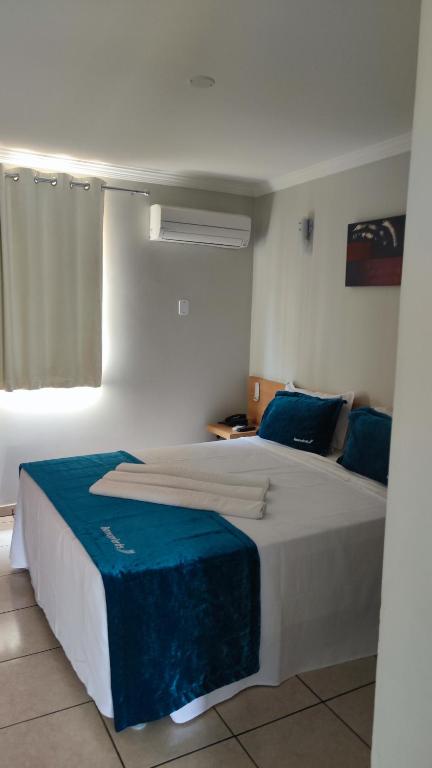 Postel nebo postele na pokoji v ubytování diRoma Fiori - Hotéis com roupa de cama --- DESTINOS COMBINADOS TURISMO