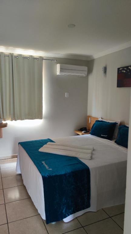 Postel nebo postele na pokoji v ubytování diRoma Fiori - Hotéis com roupa de cama --- DESTINOS COMBINADOS TURISMO