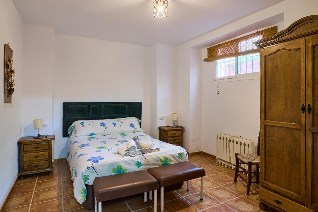Postel nebo postele na pokoji v ubytování Casa Ginés