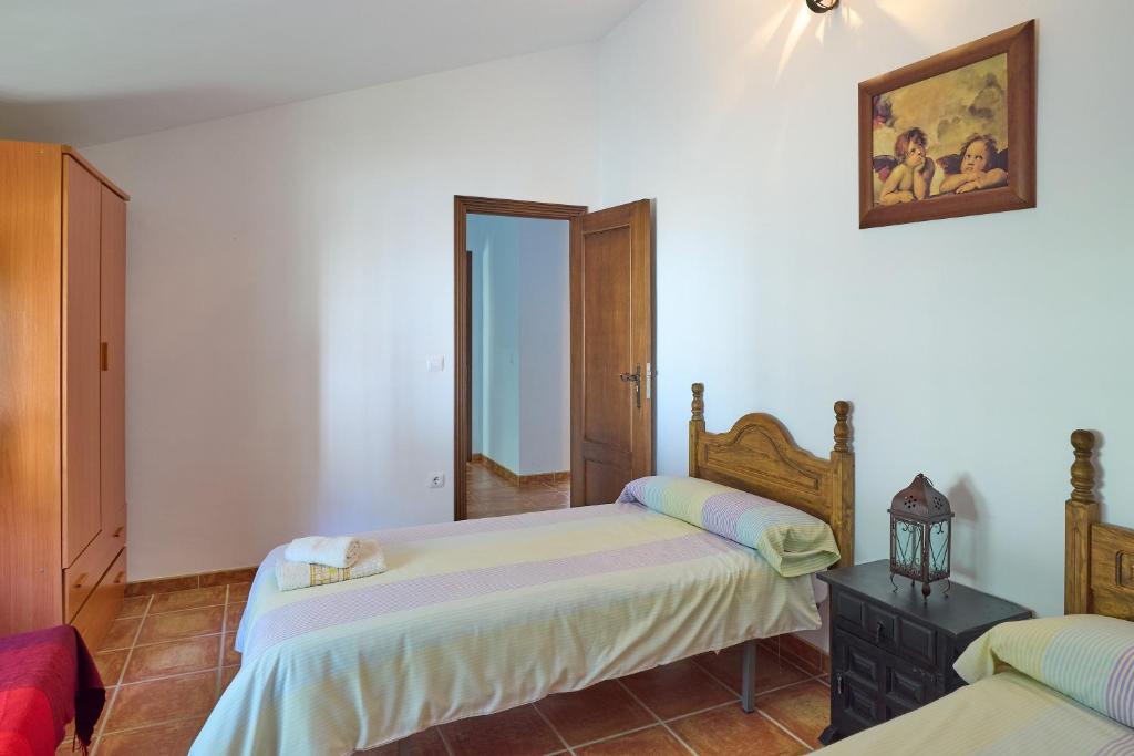 Postel nebo postele na pokoji v ubytování Casa Ginés