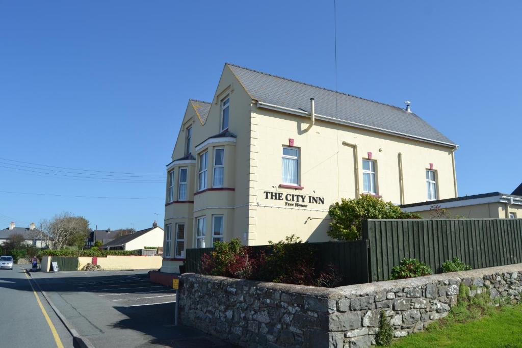 a white building with the city inn written on it at City Inn in St. Davids