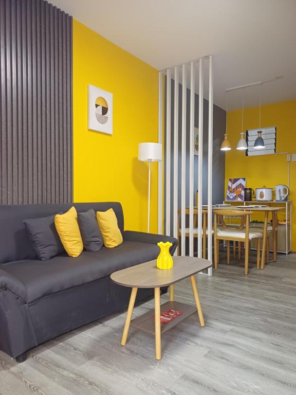 a living room with a couch and a table at Fully-furnished House Near Puan, Bago & Baliok in Davao City in Davao City