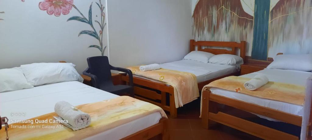 Postel nebo postele na pokoji v ubytování Hostal posada San jose