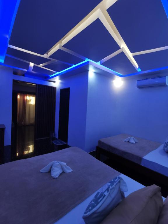 Postel nebo postele na pokoji v ubytování Kimura Beachfront El Nido